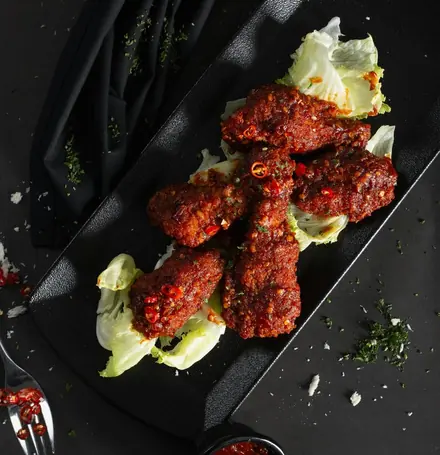 Chilli wings on a slate board